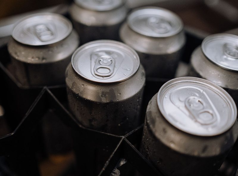 Chilled aluminum cans with condensation in a delivery case